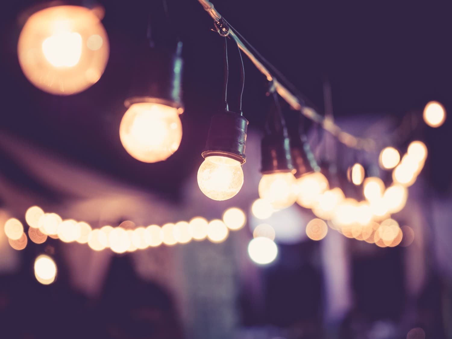 Outdoor string lights at a festival