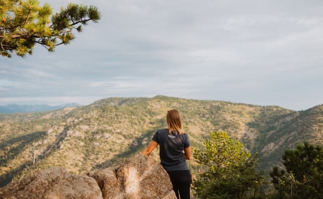 girl overlooking mountain range