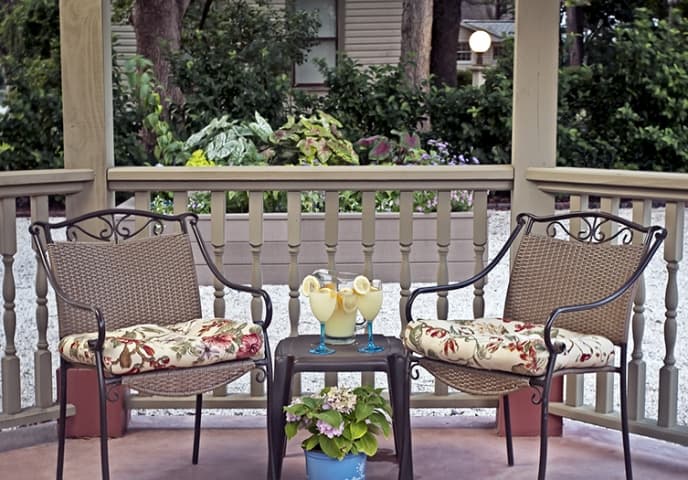 outdoor patio with two tables and chairs