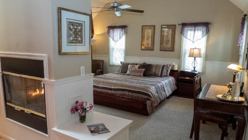The Pattison Deluxe Room King Bed and Double-Sided Fireplace
