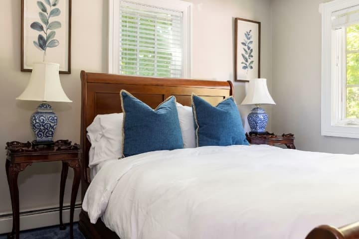 guest room with blue pillows