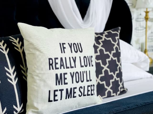 Bedding with pillows at Chateau Bourbon