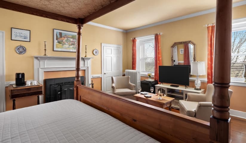 Chagall king bedroom with fireplace and seating area