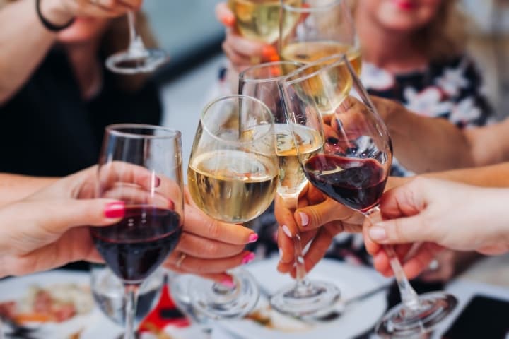 Friends toasting with glass of wine