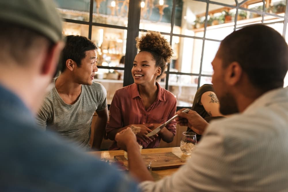 Diverse group of friends relaxing at the best restaurants in Gettysburg, Pa