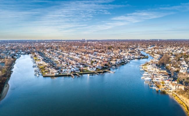 An aerial view of a bayside town.