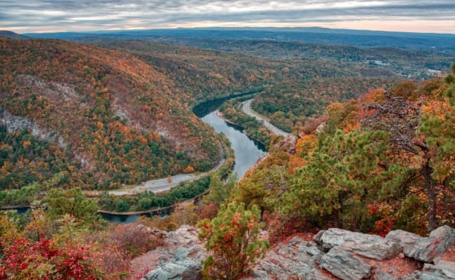 A river winding through the Poconos Mountains in the fall.