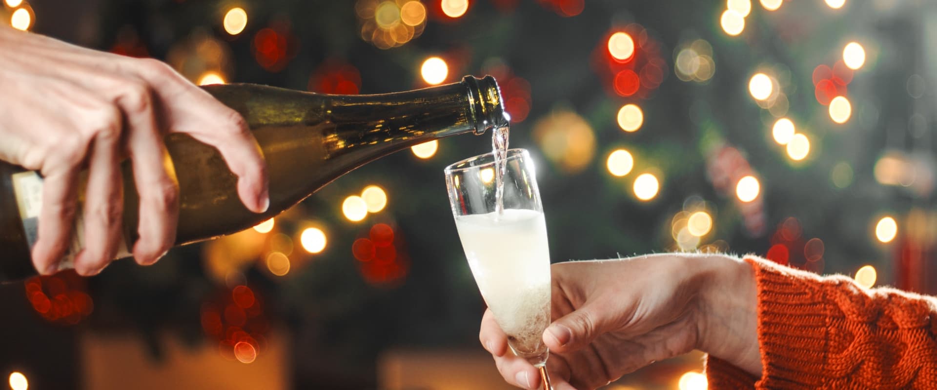 Pouring champagne on New Year's Eve