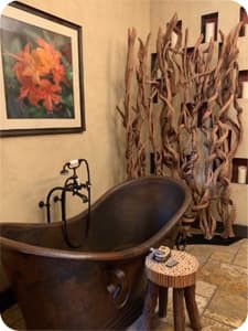 A copper clawfoot tub