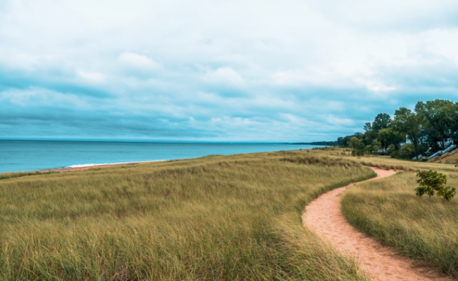 A dirt trail winding towards the Great Lakes.