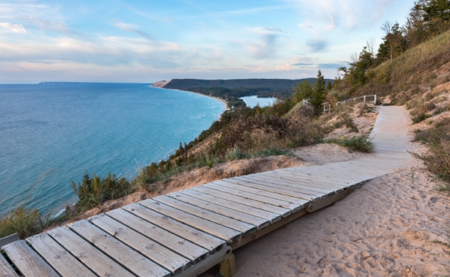 A boardwalk on the beach by a Northern Michigan lake.