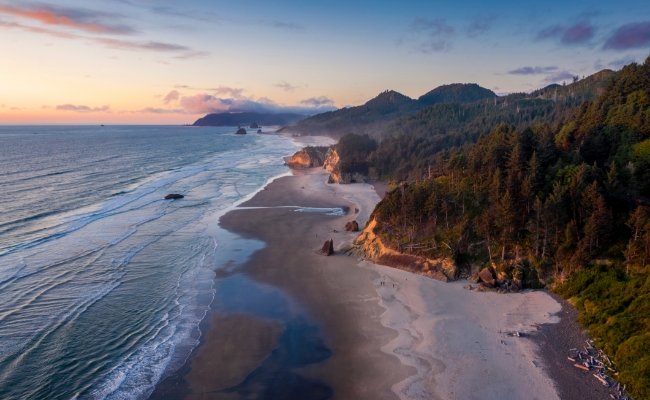 The sun setting over a beach on the Oregon Coast.