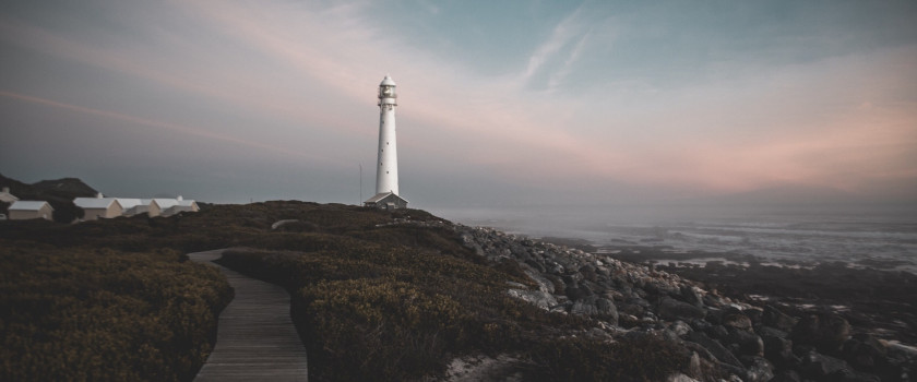 A beachfront lighthouse overlooking the water