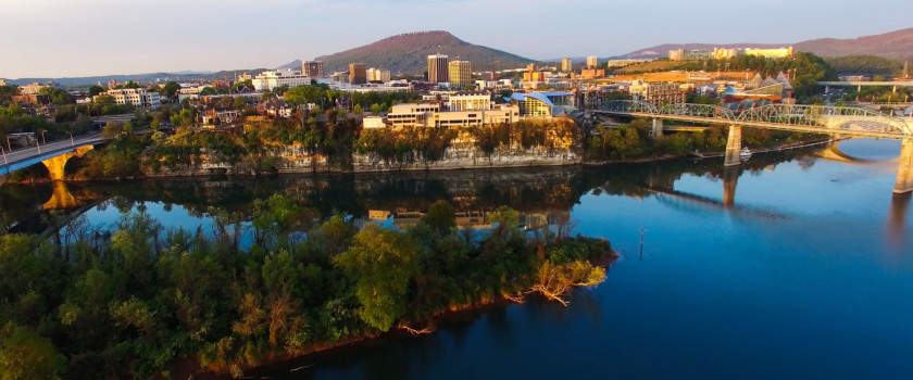 Aerial view of a waterfront cityscape.