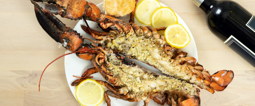 Oven-baked Maine lobster on a plate.