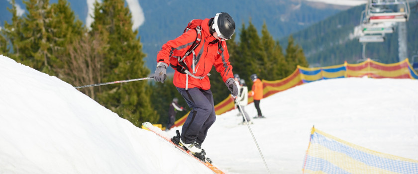 Skier on a snowy slope at ski resort