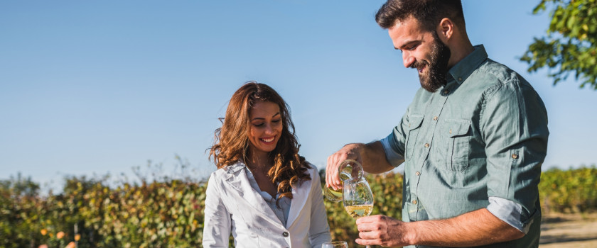 A couple drinking wine at a vineyard in Virginia