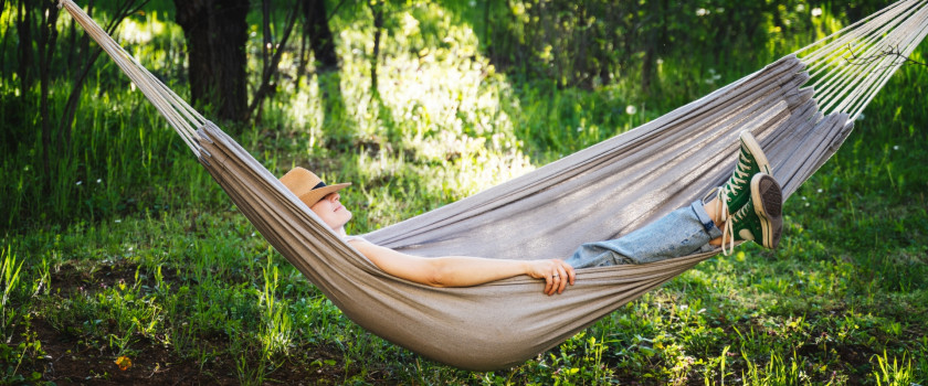 woman laying in a hammock during a solo travel trip