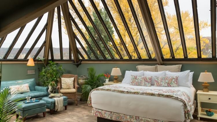 The glass ceiling bedroom at Sayre Mansion is the perfect place to stargaze