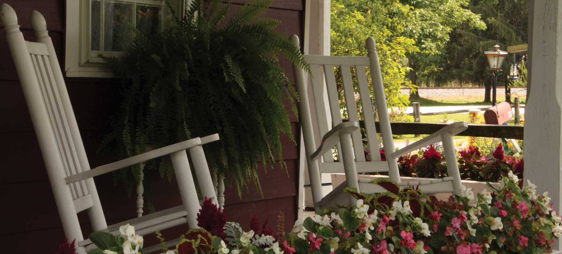 Rocking chairs on the porch at Hickory Bridge Farm Restaurant and Bed & Breakfast