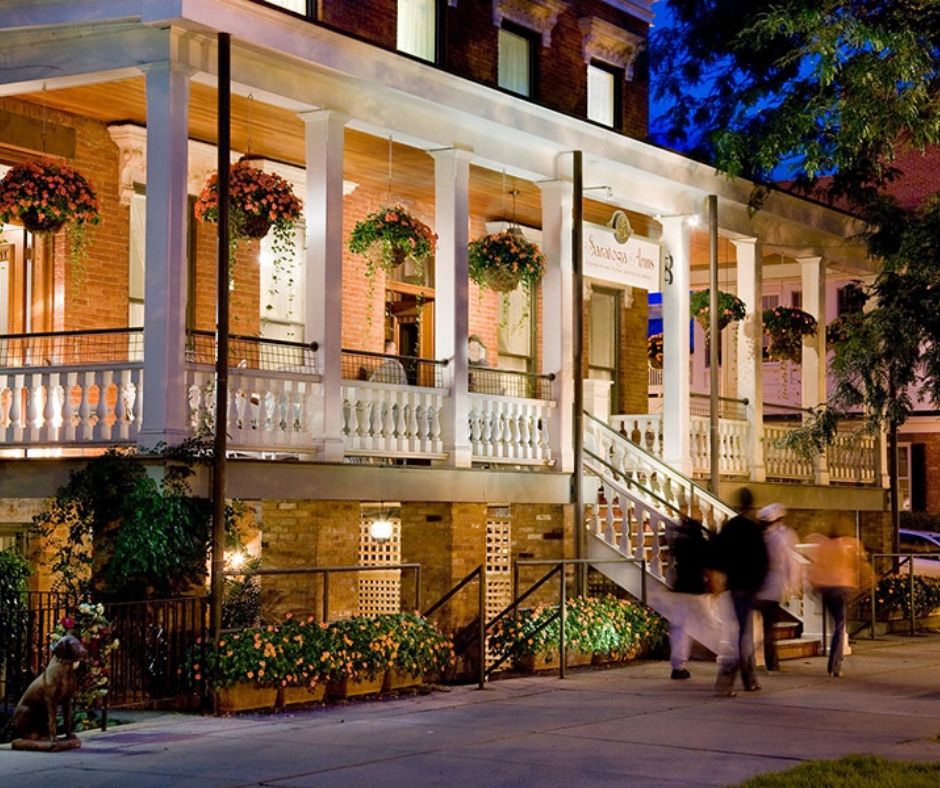 The exterior of Saratoga Arms at night.