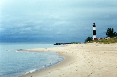 coastal view of ocean and lighthouse in ludington mi