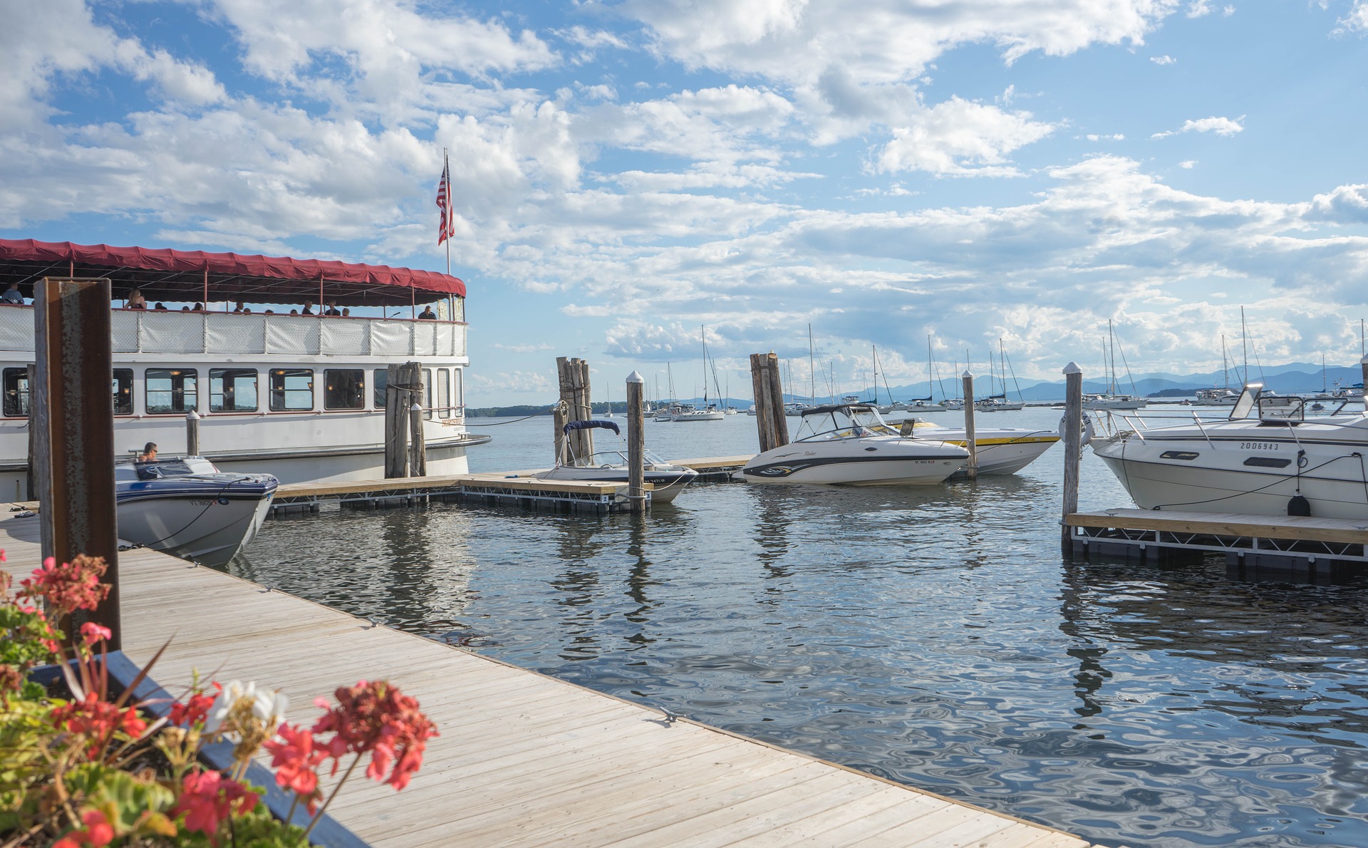 beautiful waterfront view of dock and boats in VT, things to do in middlebury, vt, this summer