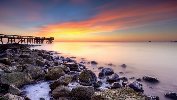 wooden pier on the Chesapeake Bay at sunrise