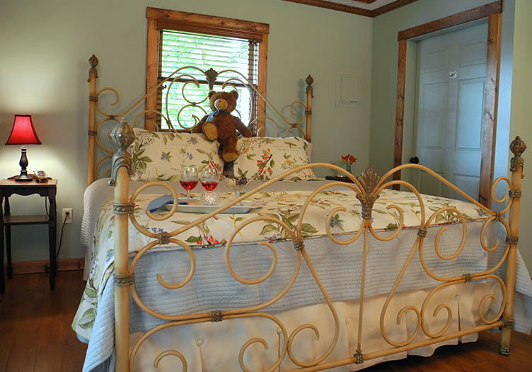Blueberry Cabin ornate bed frame beautiful furnshings