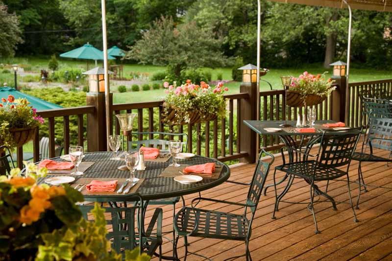 An outdoor deck with tables