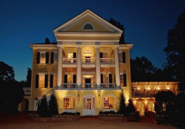 Exterior of Willow Grove, lit up in the evening
