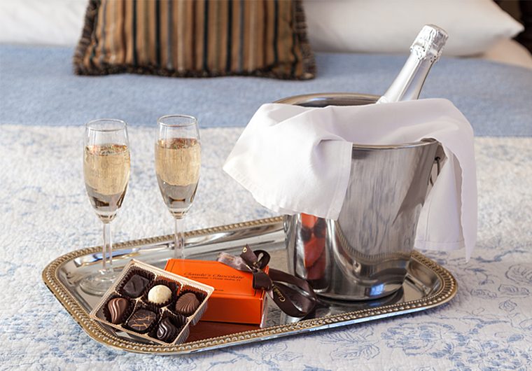 Champagne in St. Francis keepsake Flutes and chocolates from local chocolatier
