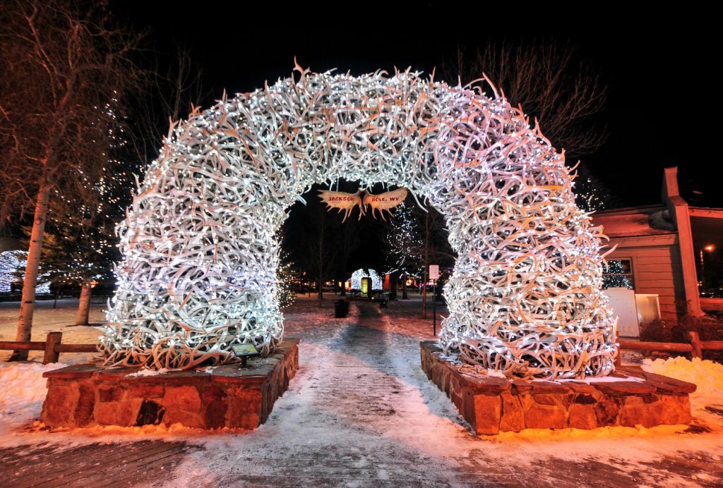 Large elk antler arches curve over Jackson Hole's square's four corner entrances. The antlers have been there since the early 1960s, and new arches are currently assembled to replace them.