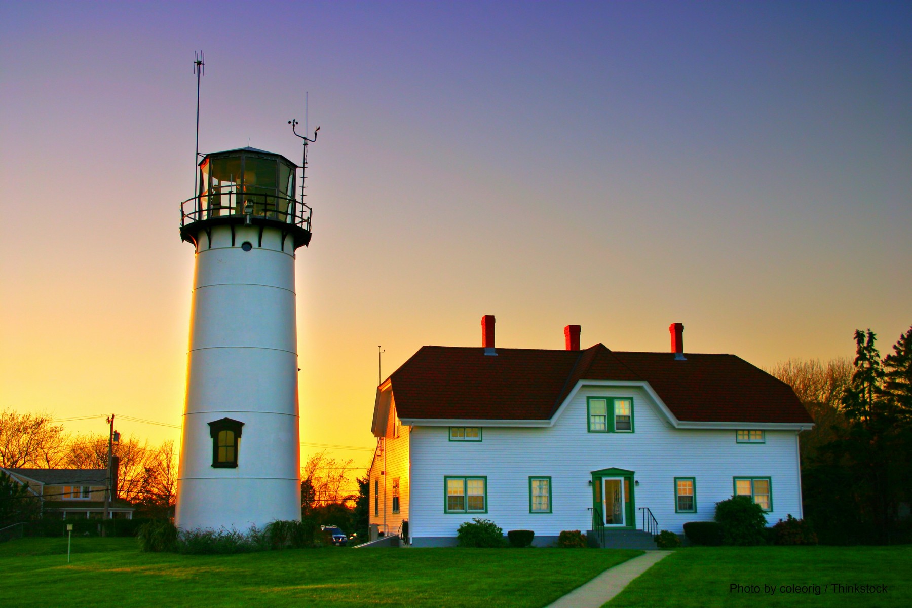 chatham lighthouse with brilliant sunset paining the sky