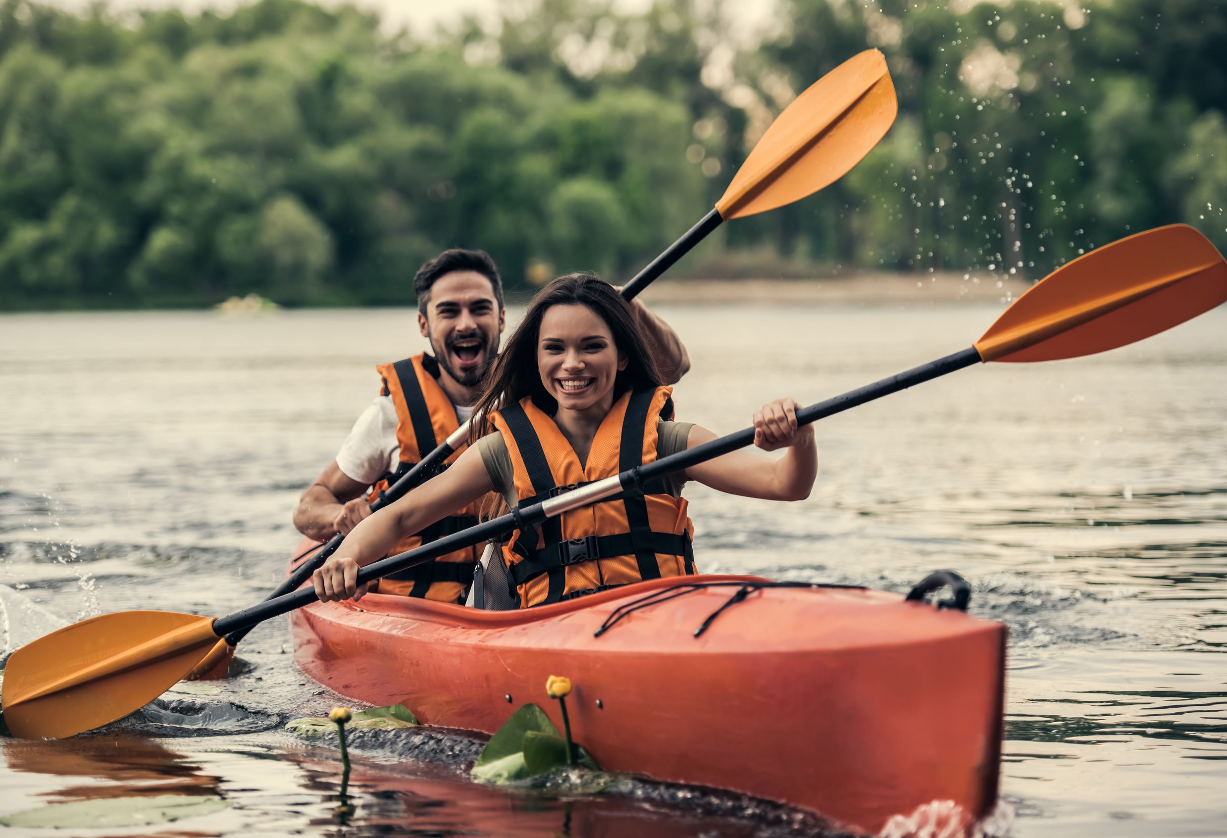 Couple Travelling By Kayak