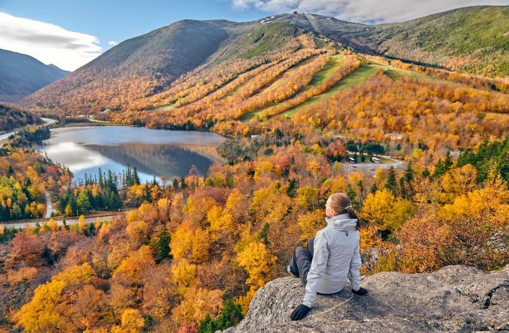 hiking to an overlook for fall foliage near the Lakes Region of New Hampshire