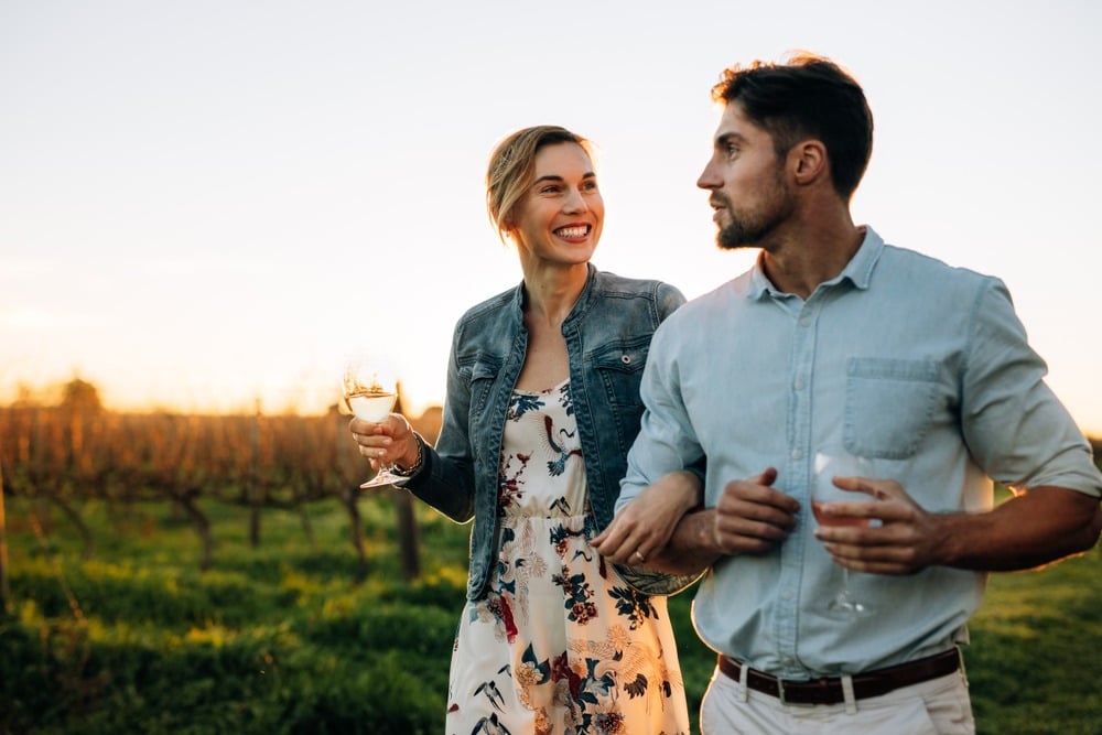 A young couple enjoying Enjoy Wine Tasting at the best Northern Georgia Wineries This Summer