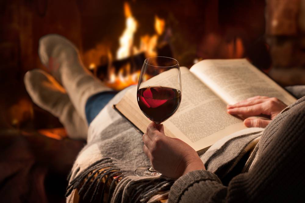 Curling up with a book in front of the fire is one of the best ways to enjoy romantic getaways in New England