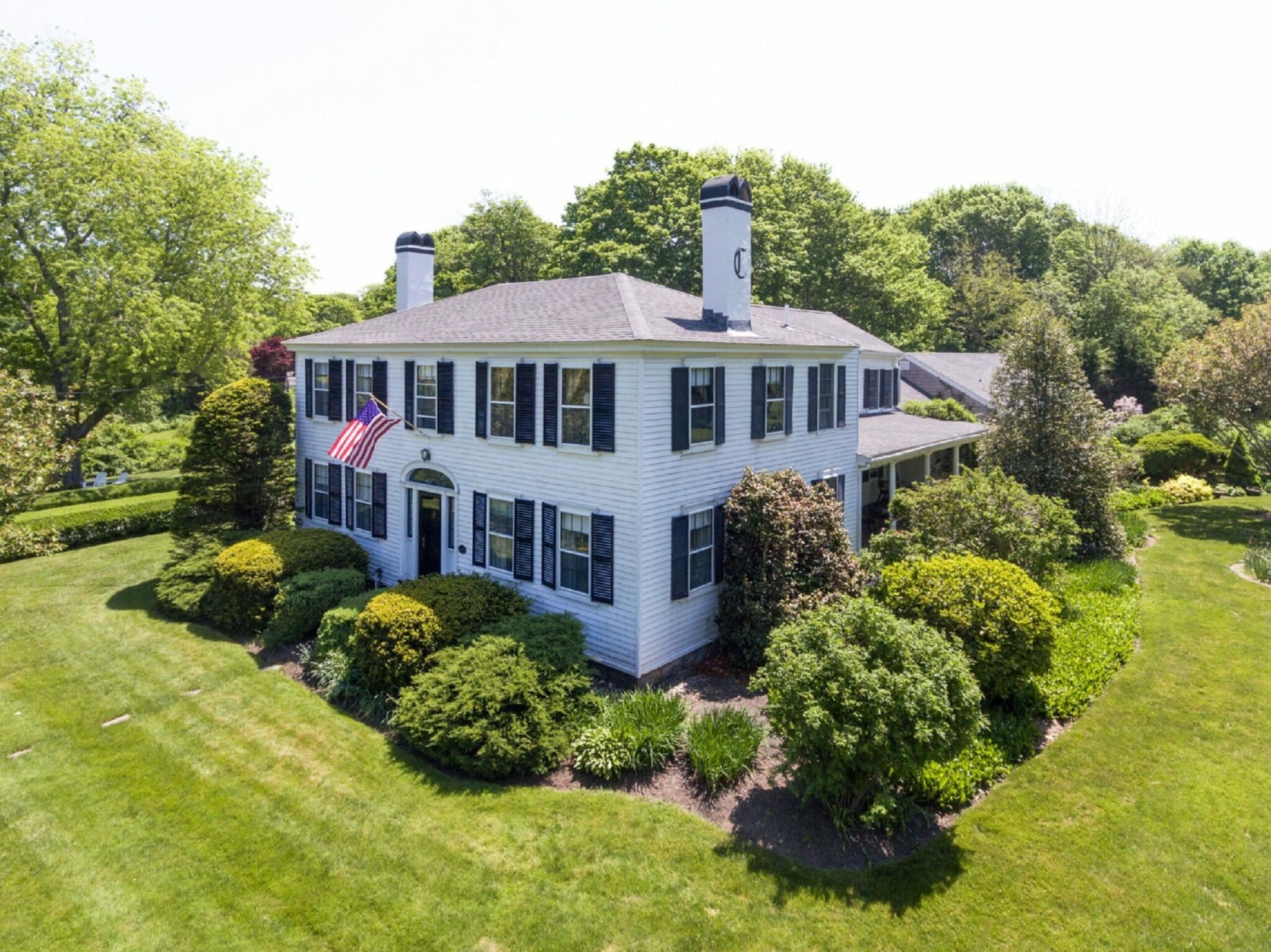Aerial image of front of inn and lawn