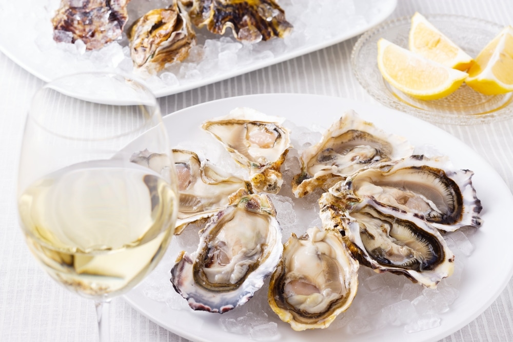 Head to these wineries in Virginia and enjoy this delicious pairing of oysters with white wine