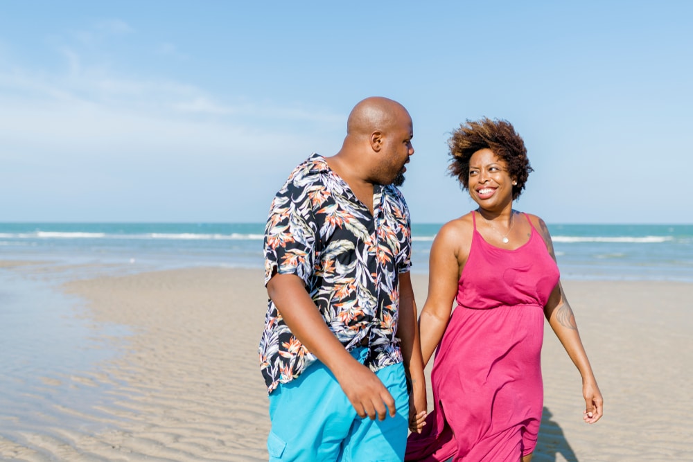 black couple enjoying a coastal getaway at the best beaches in North Carolina