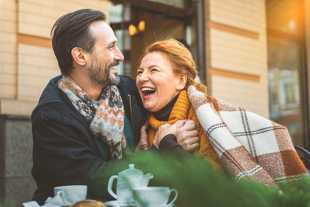 Couple laughing and having fun during romantic getaways in New England