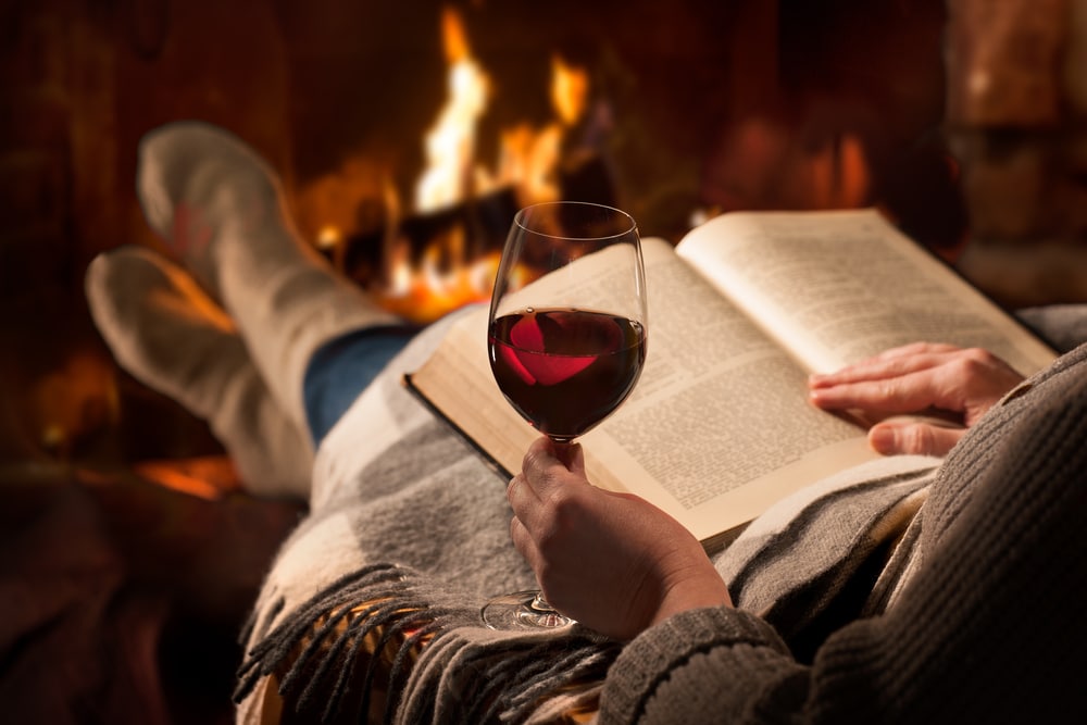 a glass of wine by the fire - there are many more things to do in Napa This winter than visiting Napa Valley Wineries